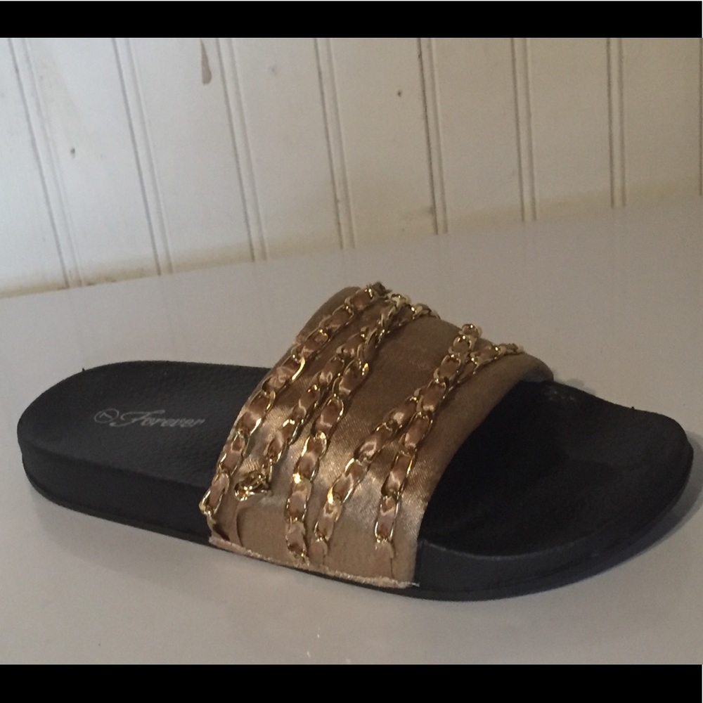 Gold satin and chain slides.